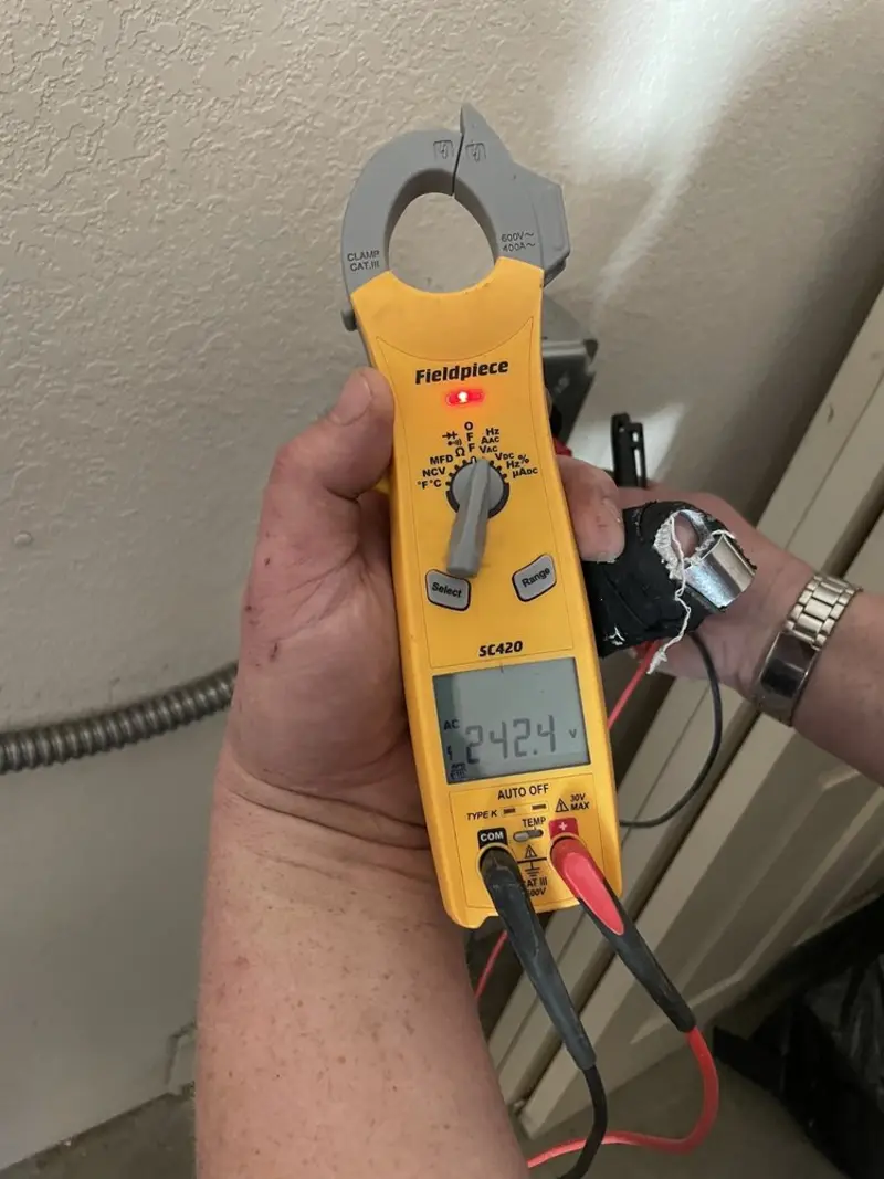 Voltage testing with clamp meter during Generator Installation in Castle Hills